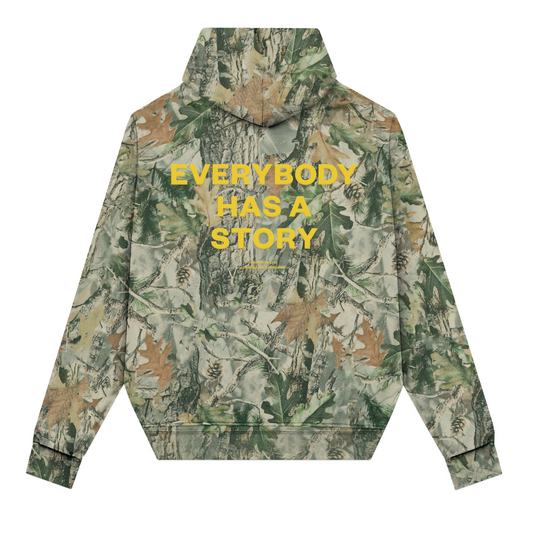 EVERYBODY HAS A STORY HOODIE CAMO